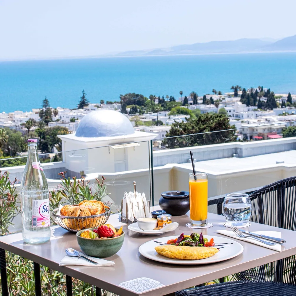 Fresh fruit, juices and sweet things on the morning table
